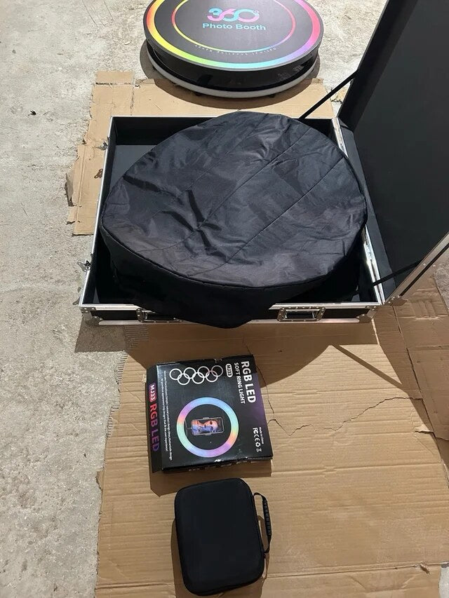 Spin Metal 360 photo booth platform, carrying bag, light, and accessories ready for setup.