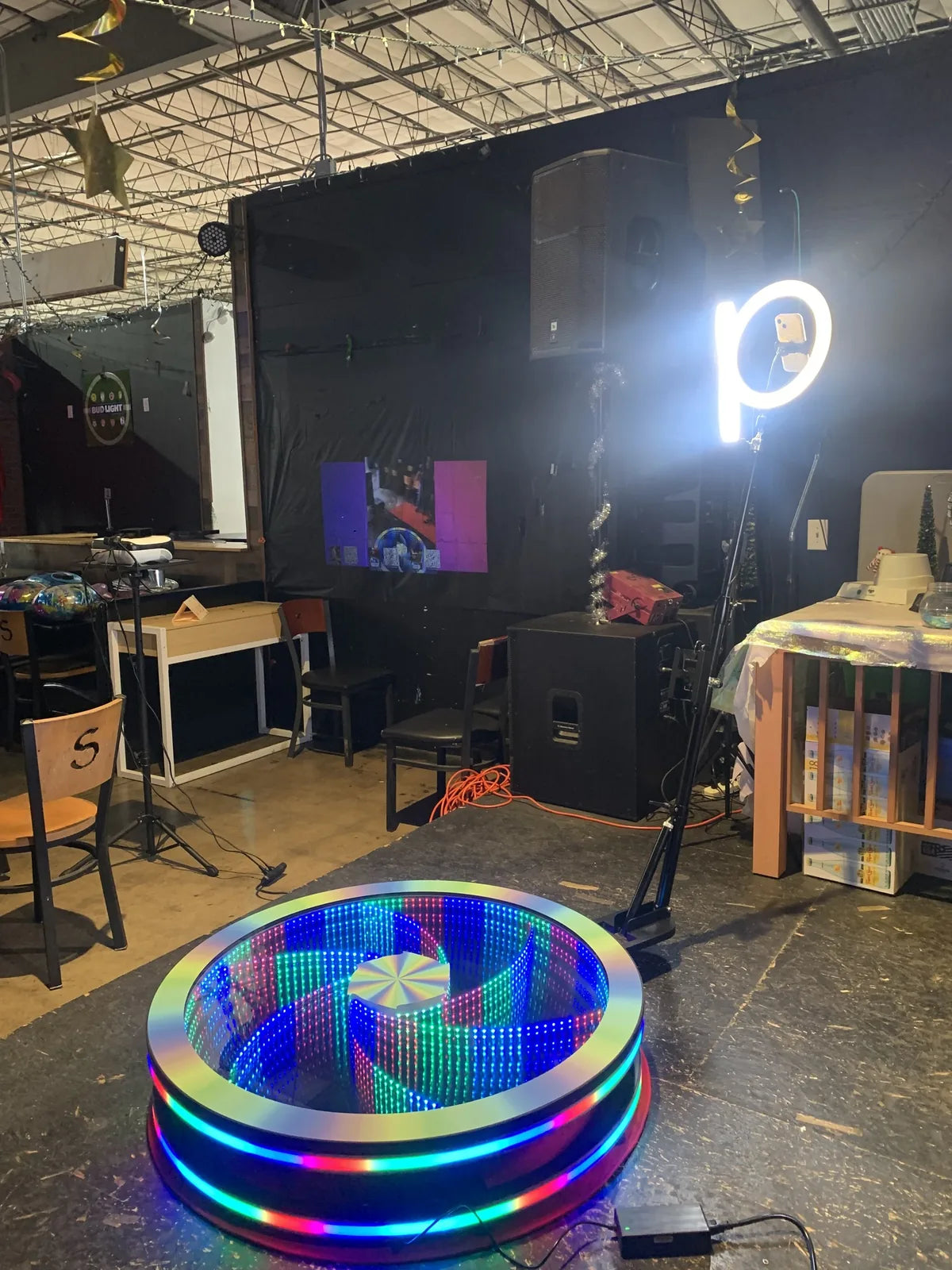Spin Vortex glass 360 photo booth at a real Smart 360 customer venue setup with RGB platform lighting.