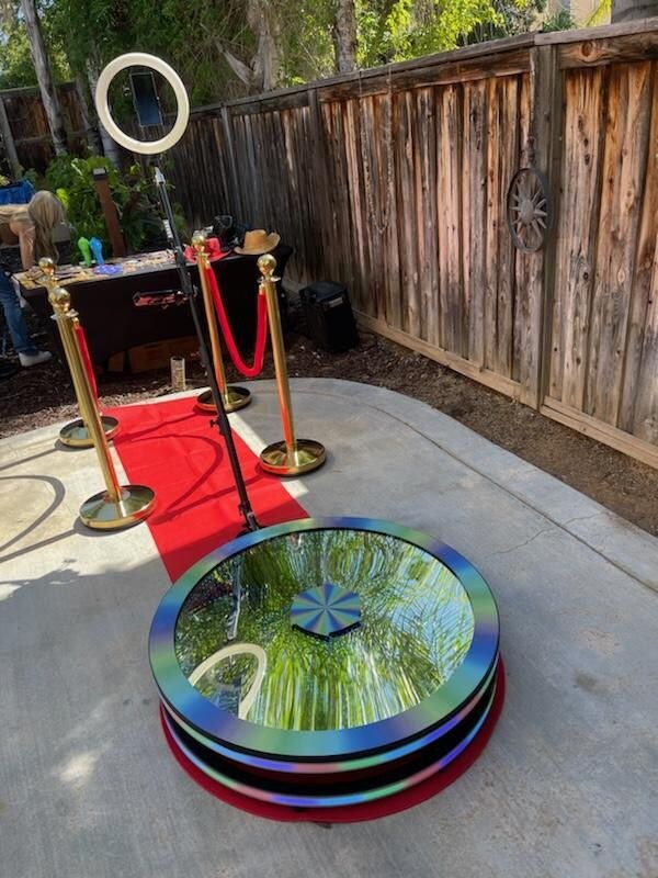 Spin Vortex glass 360 photo booth with an outdoor red carpet setup.