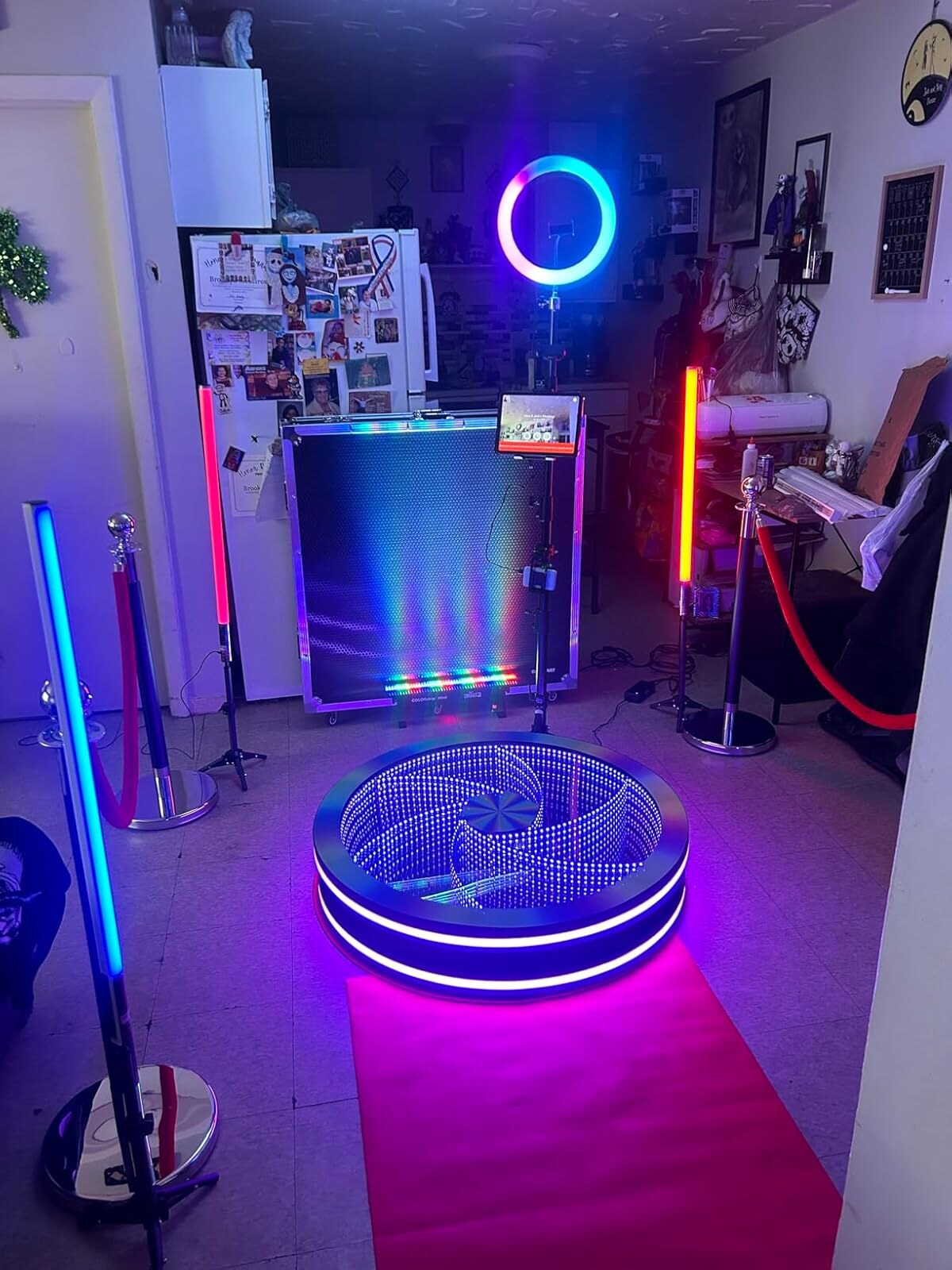 Spin Vortex glass 360 photo booth showcasing RGB platform lighting.